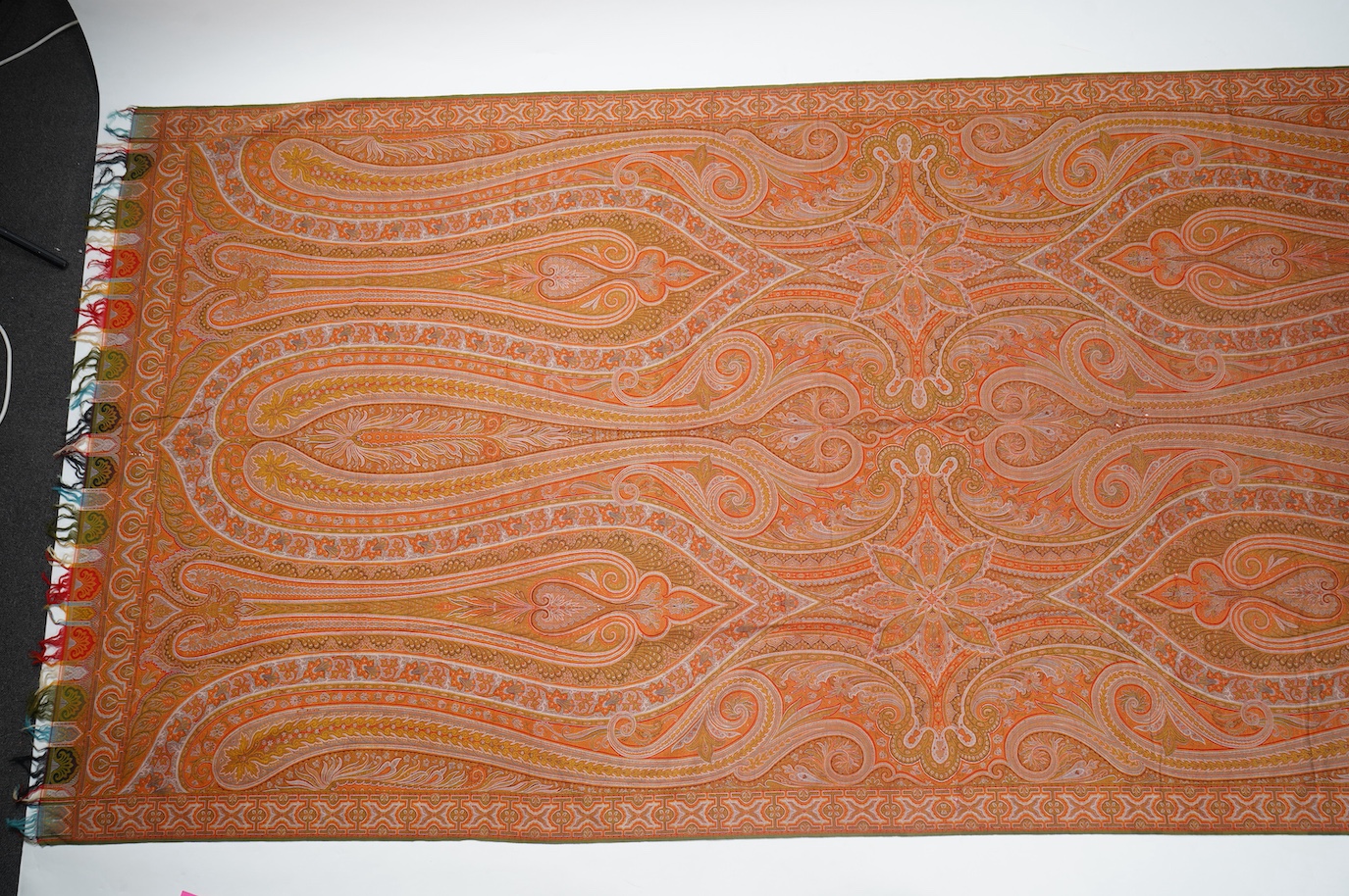 A French possibly Lyon, 19th century ornate silk and fine wool woven Paisley patterned shawl. Woven in polychromes coloured silks and wools on a jacquard loom, using an array of punch cards to create this elaborate desig